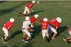 Nick Price handing off the ball during a scrimmage. 